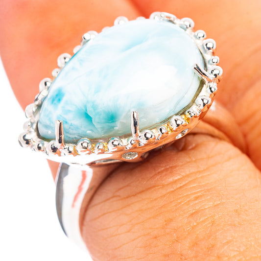 Sterling silver ring with oval blue larimar cabochon and bead prong setting
