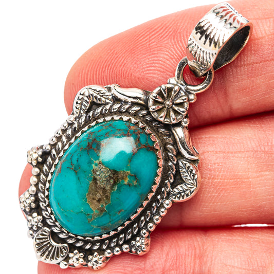 925 sterling silver turquoise oval pendant with ornate border and flower bail