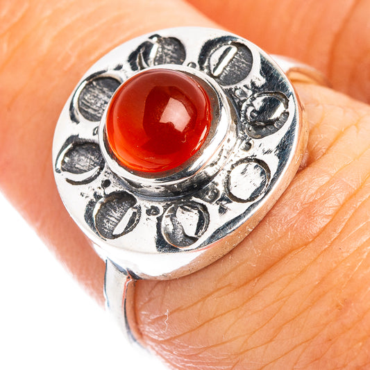 Sterling silver dainty ring with red-orange oval carnelian center and engraved band