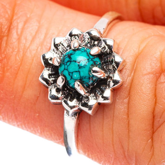 Sterling silver turquoise ring with round cabochon and detailed floral setting