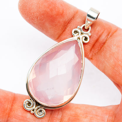 Rose quartz teardrop pendant in .925 sterling silver with scroll setting