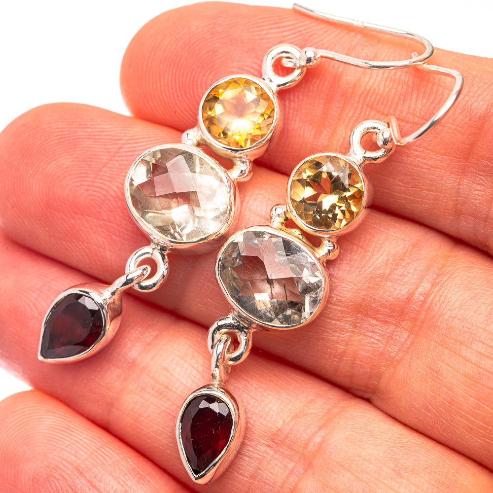 Sterling silver dangle earrings with yellow, clear, and red faceted stones