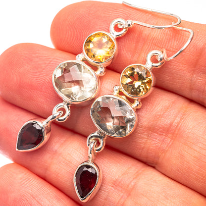 Sterling silver dangle earrings with yellow, clear, and red faceted stones