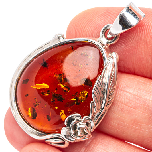 Amber rose pendant with oval Baltic amber cabochon in 925 sterling silver setting