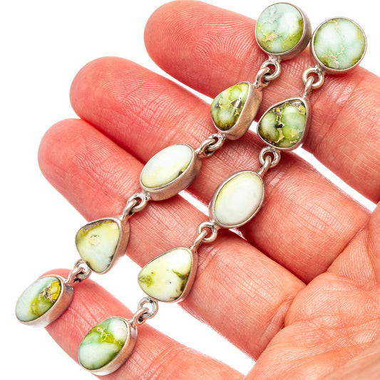 Sterling silver dangle earrings with oval green-gold turquoise stones and linked drops