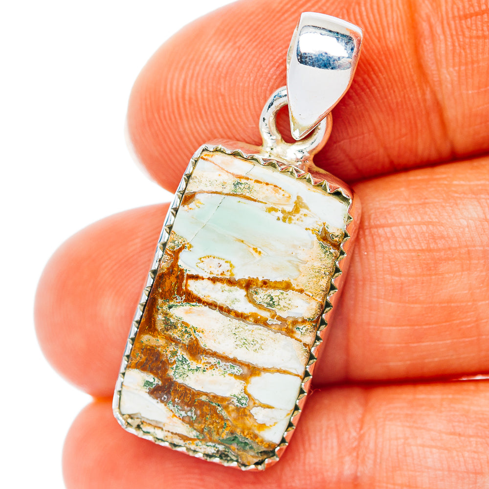 Sterling silver turquoise pendant with rectangular bezel and top bail