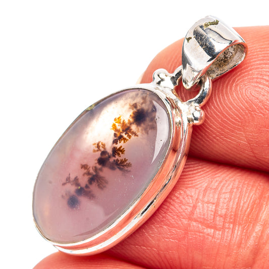 Oval pink dendritic agate pendant in .925 sterling silver bezel setting