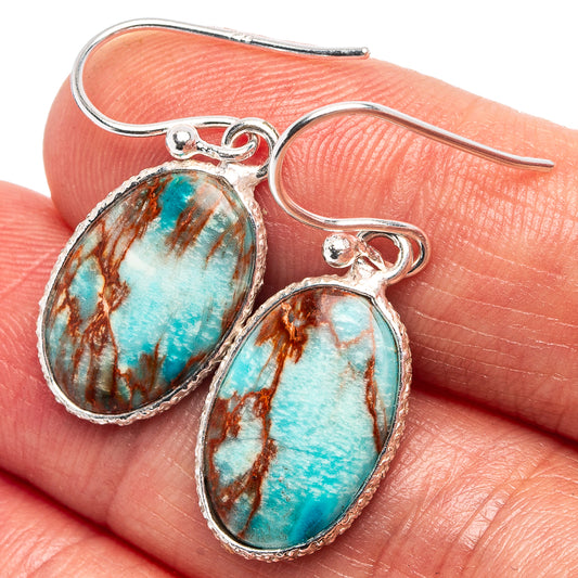 Sterling silver dangle earrings with blue imperial jasper teardrop stones, fishhook backs.