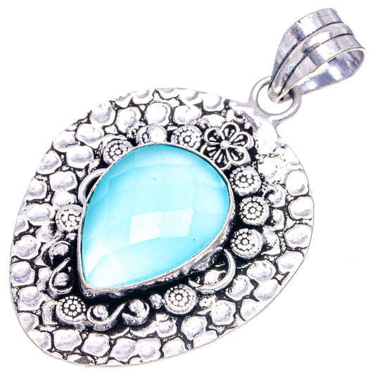 German silver chalcedony pendant with oval turquoise gemstone and floral textured frame