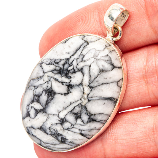 Oval .925 sterling silver pendant with white pinolith jasper and dark marble-like veins