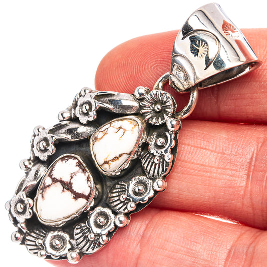 Sterling silver wild horse jasper pendant with oval cabochon stones, side view.