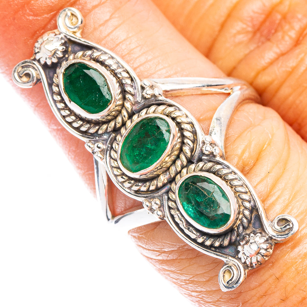 Sterling silver ring with three oval green gemstones in ornate settings
