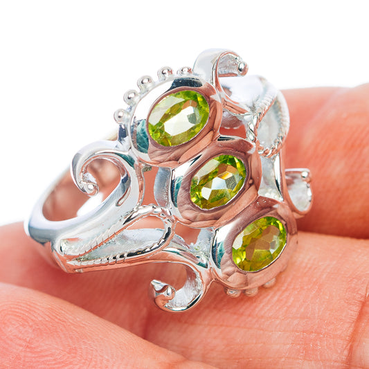 Sterling silver peridot three-stone ring with green gemstones, size 9