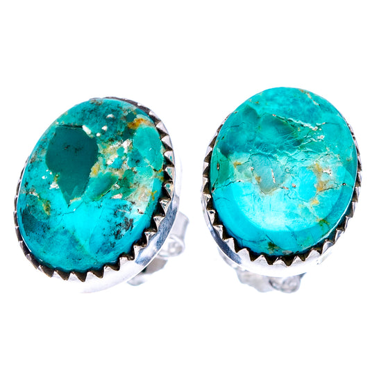 Turquoise stud earrings pair with oval stones and serrated .925 sterling silver bezels.