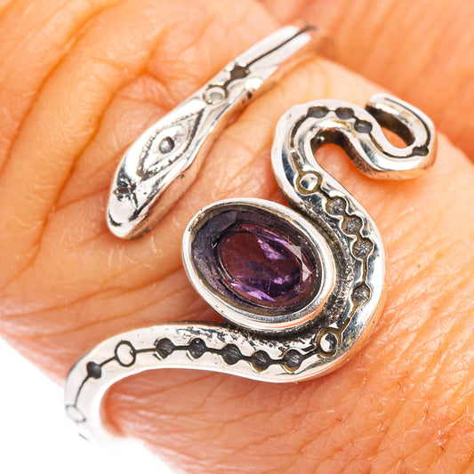 Sterling silver snake dainty ring with oval purple amethyst gemstone on finger
