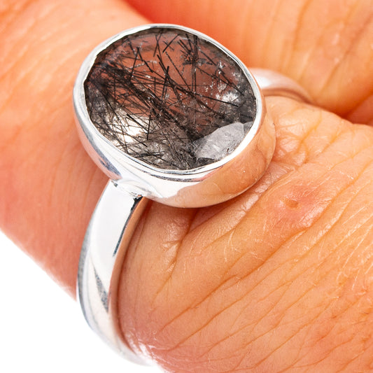 Sterling silver tourmalinated quartz ring, oval stone in close-up with dark needles