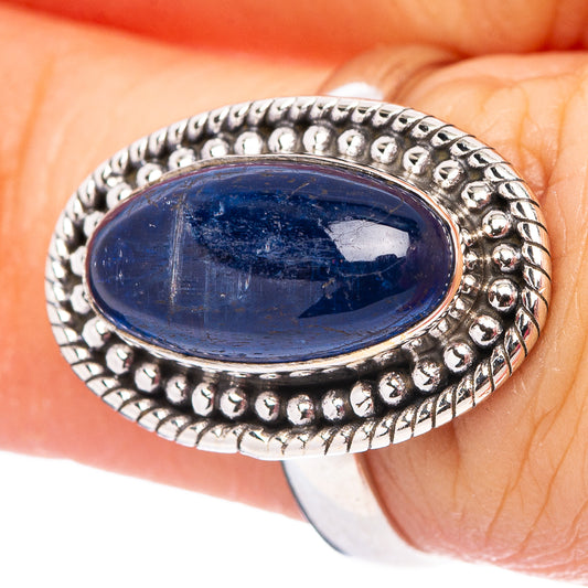 Sterling silver kyanite ring close-up, oval blue cabochon with bead-framed border