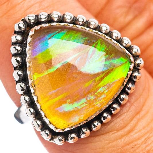 Ethiopian opal ring with pear-cut rainbow gemstone and beaded sterling silver bezel
