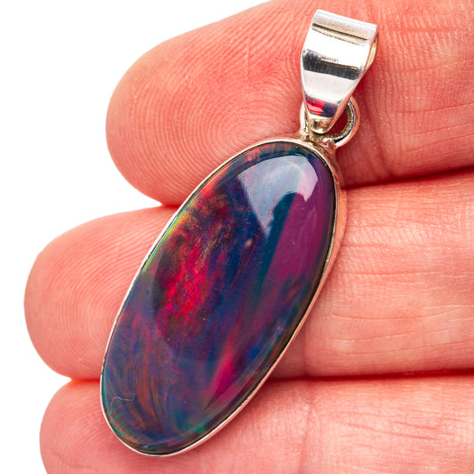 Sterling silver oval opal pendant with prong-set iridescent blue and purple stone