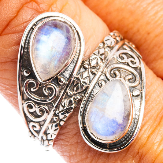 Sterling silver moonstone ring with two oval rainbow cabochons and ornate filigree