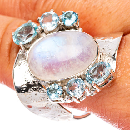 Oval rainbow moonstone ring with blue topaz accents in 925 sterling silver, prong-set stones