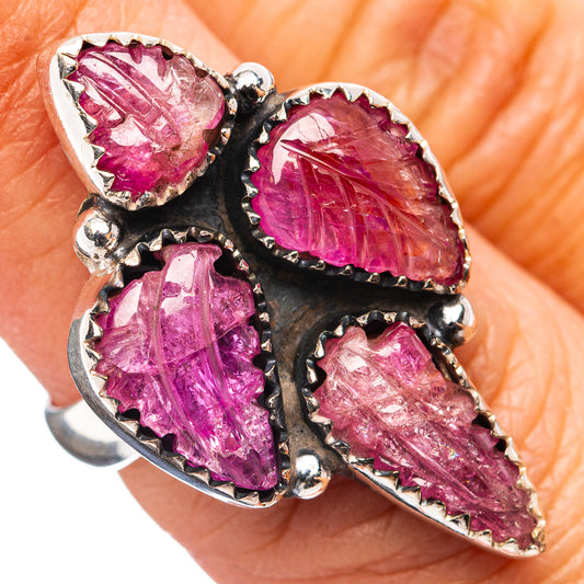 Sterling silver ring with four marquise carved pink ruby stones in black bezel setting