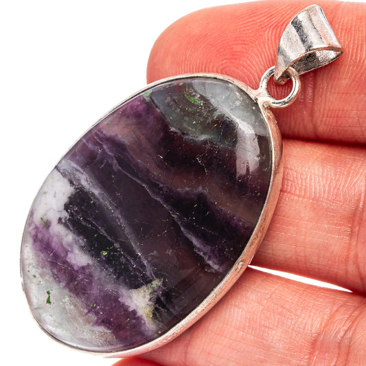 Fluorite gemstone pendant with silver-tone bail, oval dark purple and gray stone cabochon