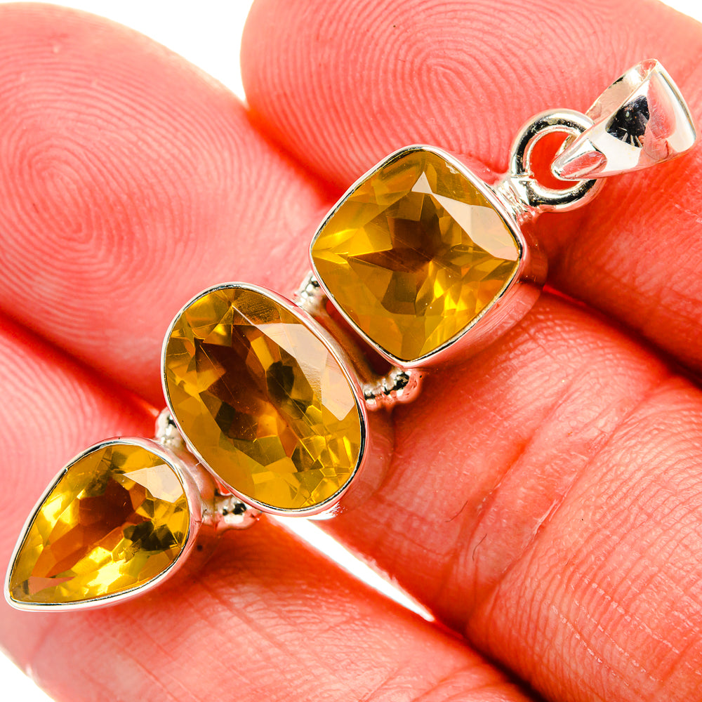 Three-stone citrine pendant with faceted yellow teardrop gems in sterling silver
