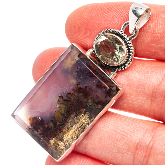 Sterling silver pendant with rectangular plume agate and round green gemstone top