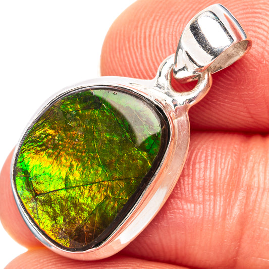 Oval ammolite pendant in .925 sterling silver bezel, bright green iridescence close-up