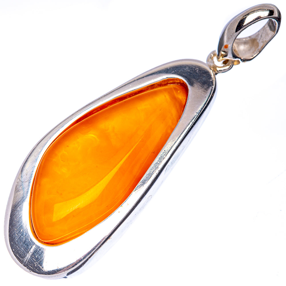 Oval amber pendant in sterling silver with curved frame and small bail loop