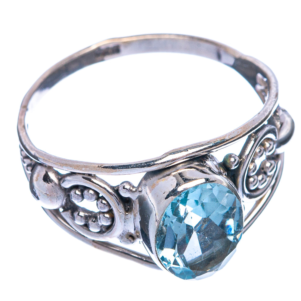 Sterling silver ring with oval blue gemstone and ornate filigree sides