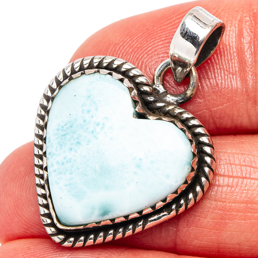 Heart-shaped larimar pendant in .925 sterling silver with rope-edge frame and bail