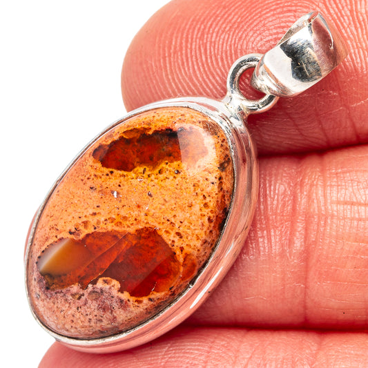 Oval .925 sterling silver fire opal pendant, orange with dark inclusions, with bail
