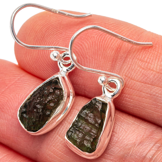 Moldavite earrings with teardrop green stone in .925 sterling silver hook, close-up
