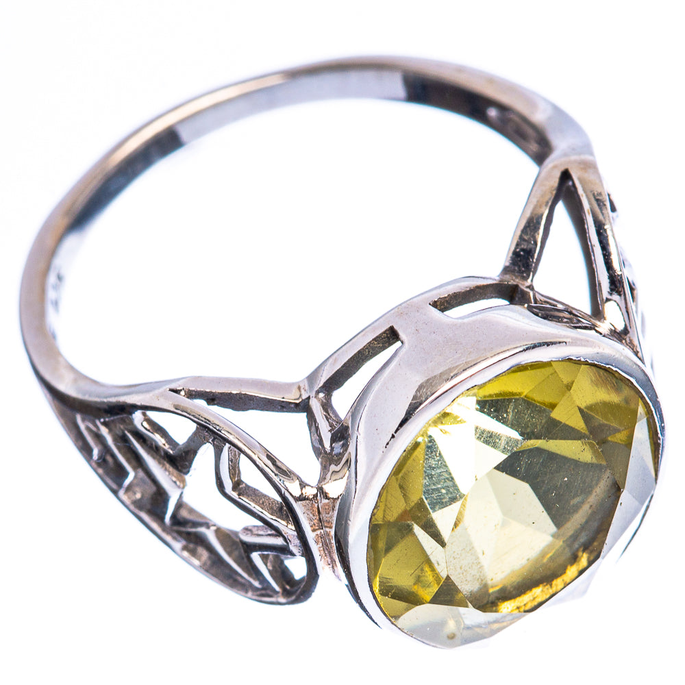 Sterling silver ring with faceted round citrine stone and openwork side scrollwork