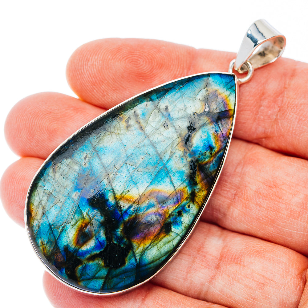 Large teardrop spectrolite pendant with blue-green iridescent stone and .925 sterling silver bail