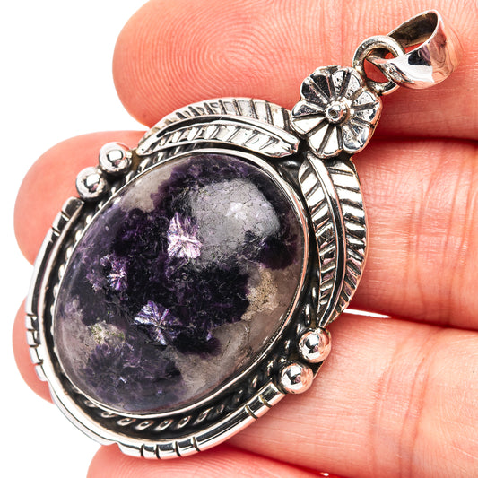 Lepidolite pendant with oval purple cabochon in ornate .925 sterling silver bezel