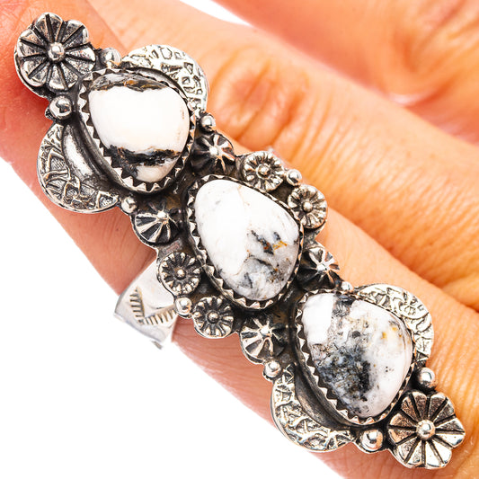 Silver adjustable ring with five oval white buffalo-style cabochons and sunburst accents.