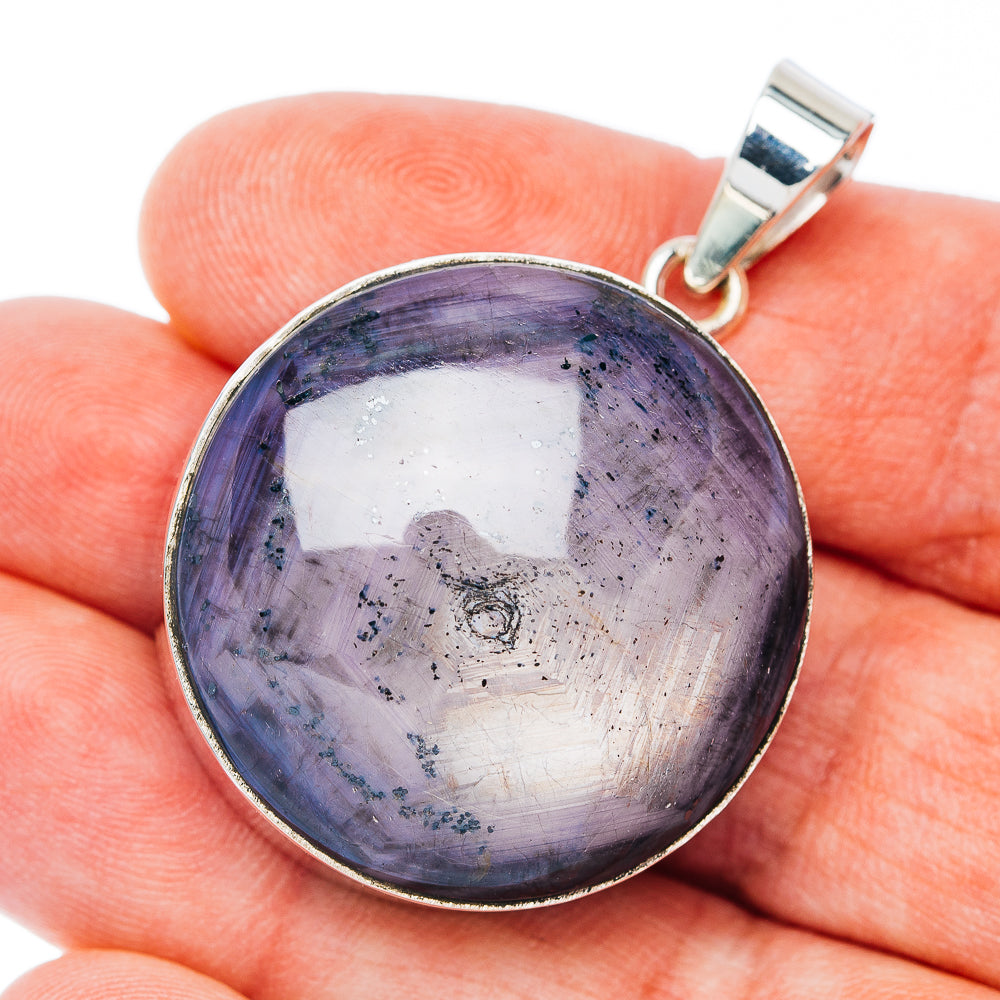 Large star ruby pendant with round sterling silver bezel and dark purple cabochon