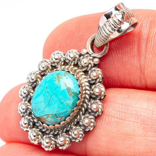 Turquoise pendant with sterling silver native-style bezel and ornate bead border