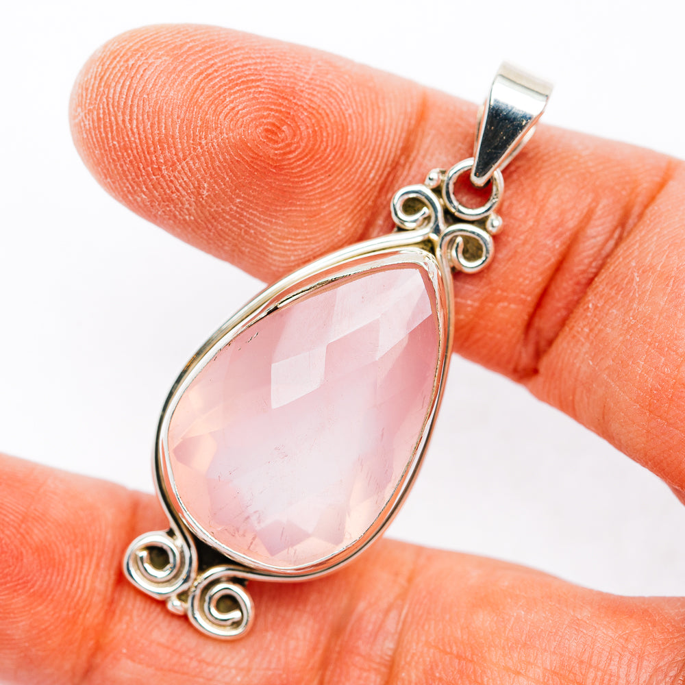 Rose quartz teardrop pendant in .925 sterling silver with ornate swirls and bail
