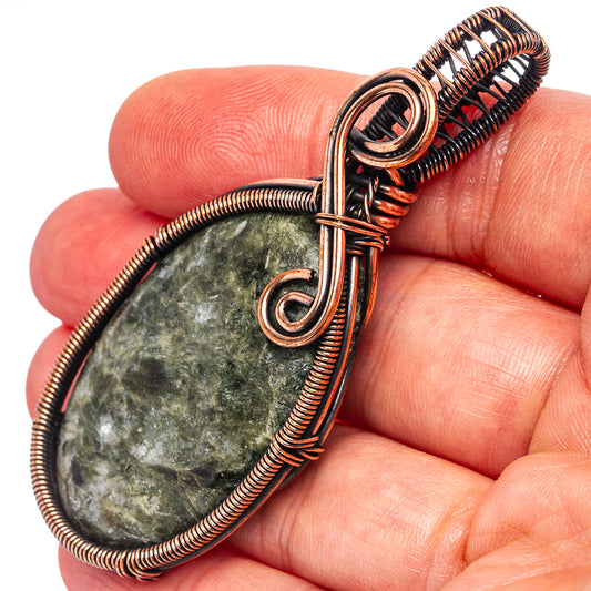 Oxidized copper wire-wrapped seraphinite pendant, teardrop stone with spiral bail
