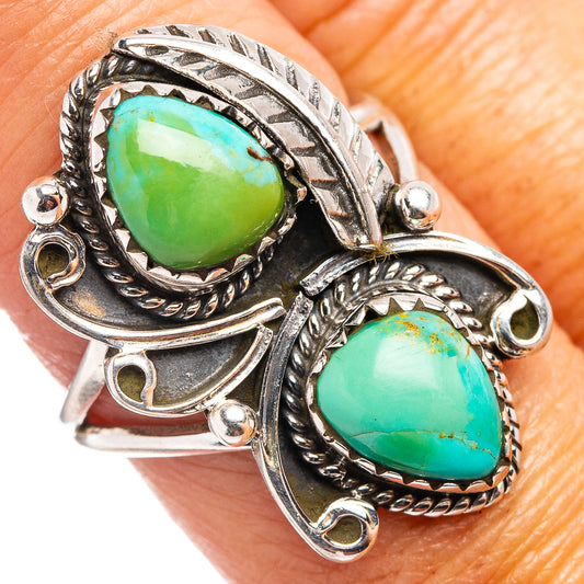 Sterling silver turquoise ring with two oval stones and ornate engraved bands