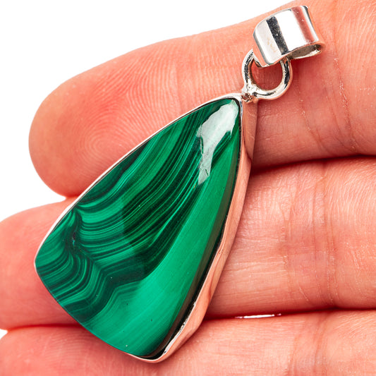 Malachite teardrop pendant, .925 sterling silver bail detail and striped green stone.