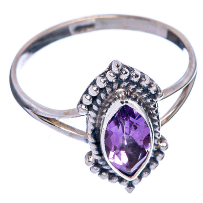 Sterling silver ring with oval faceted amethyst and ornate beaded halo setting