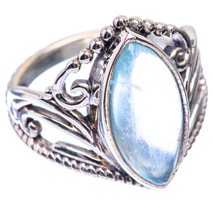 Sterling silver ring with oval light-blue stone and raised beaded metal border