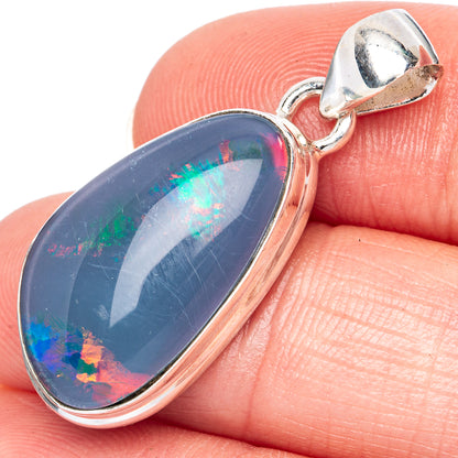 Sterling silver opal pendant with blue iridescent oval cabochon and bail