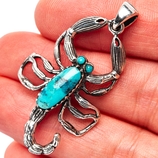Sterling silver scorpion pendant with turquoise oval stone and small bead accents