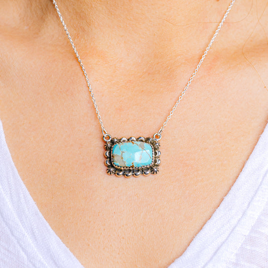 Sterling silver turquoise pendant necklace with ornate square bezel and link chain
